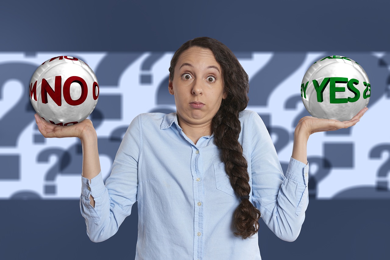 Lady with shrug expression holding yes and no balls