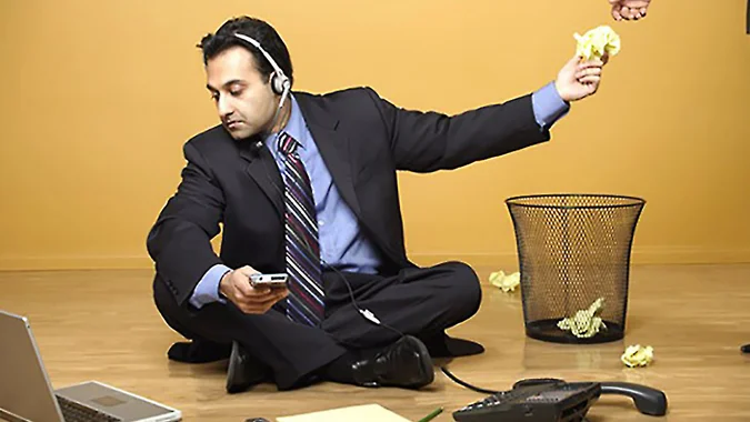 A person distracted by Reddit on their laptop, struggling with productivity